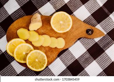 Lemon And Ginger Lie On A Wooden Board. Vitamins The Fight Against The Virus. Seasoning. Flu. Sore Throat. Food.natural Antibiotic