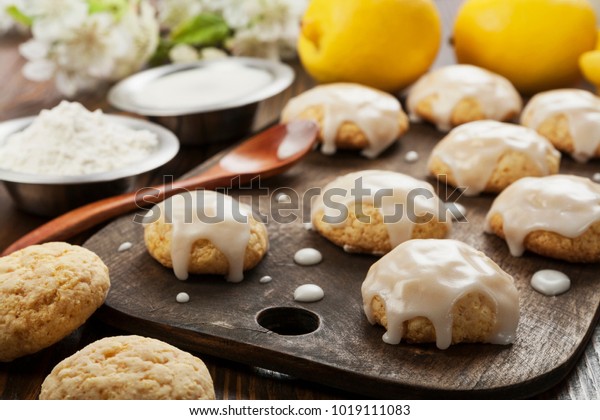 Lemon glaze cookies on\
the wooden table