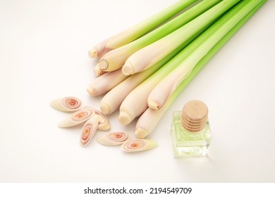 Lemon Grass With Slice And Lemon Grass Oil Bottle Isolated On White Background , Top View , Flat Lay.