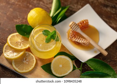 Lemon Juice With Honey On Wooden Table,  Lemons And Sage Leaves.