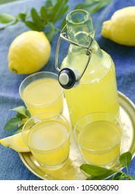 Lemon Liqour (limoncello) In Glass On Natural Background. Selective Focus