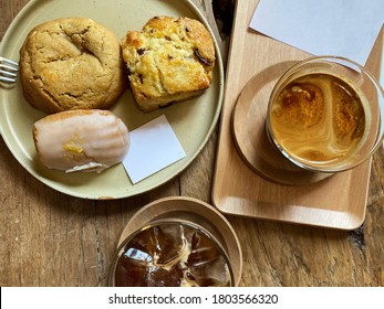 Lemon Madeleine, Butter Scone And Soft Cookie Served With Latte And Iced Black Coffee