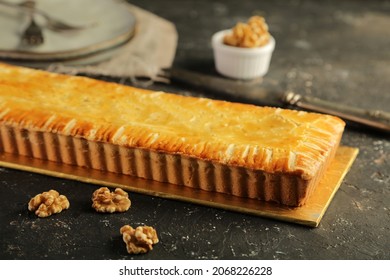 Lemon Mascarpone Tart With Nut On Rustic Background. 
