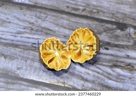 Lemon with mold, mould is one of the structures that certain fungi can form, formation of spores containing fungal secondary metabolites, decaying lemon, dry, discolored, disambiguation