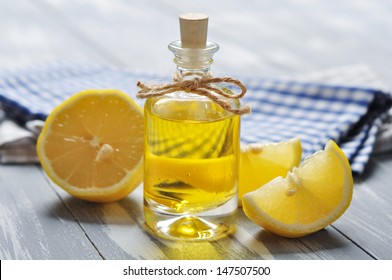 Lemon Oil In A Glass Bottle With Fresh 