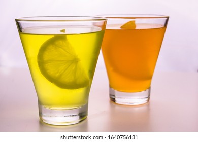 
Lemon And Orange Jelly In Glasses On A White Background.