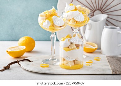 Lemon parfait with pound cake, lemon curd, whipped cream and meringue kisses