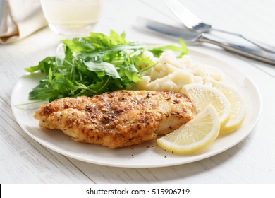 Lemon And Pepper Chicken Steak Served With Mashed Potato And Fresh Arugula Salad