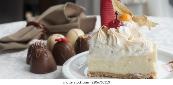 Lemon Pie With Chocolate Truffles In The Background