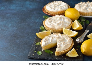 Lemon pie with meringue on a blue background