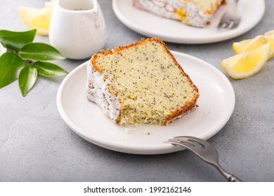 Lemon Poppy Seed Bundt Cake with powdered sugar glaze. A slice of cake on a plate.