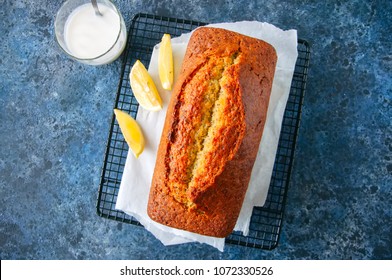 Lemon Poppy Seed Pound Cake On A Wire Rack. Blue Stone Background. Top View.