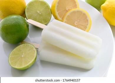 Lemon Popsicles On A White Plate