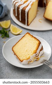 Lemon Pound Cake With Powder Sugar Glaze Baked In A Bundt Pan, Slice An A Plate