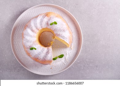 Lemon Ring Cake With Icing Sugar Served On Plate