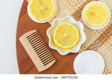 Lemon Slice, Cotton Pad And Wooden Hair Brush. Ingredients For Preparing Homemade Hair Mask Or Face Toner. Natural Beauty Treatment Recipe And Zero Waste Concept. Top View, Copy Space. 