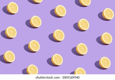 Lemon Slice Creative Pattern On  Purple Background. Yellow Trendy Color Food. Summer Fruits Creative Layout.