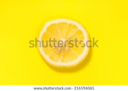 lemon slice on yellow background