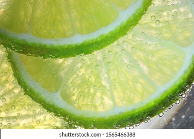 Lemon Slices In Water With Air Bubbles - Powered by Shutterstock