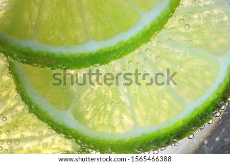 Lemon Slices In Water With Air Bubbles