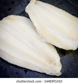 Lemon Sole Fillet Of Fish On A Black Slate