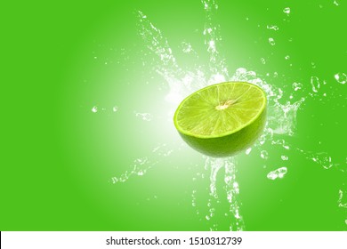 Lemon Splash On Green Background. Green Lime Splashing.