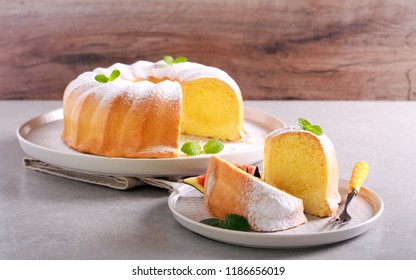 Lemon Sponge Ring Cake With Icing Sugar On Plate