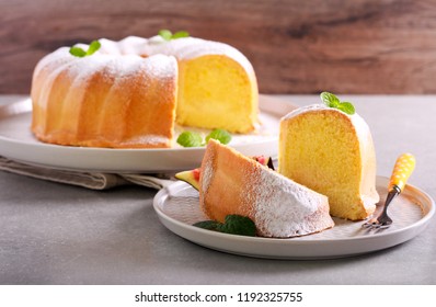 Lemon Sponge Ring Cake With Icing Sugar On Plate