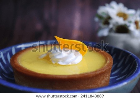 Lemon Tart or lime key pie.  A perfect blend of sweet and tangy taste. A buttery, golden crust embraces a luscious lemon filling, promising a burst of citrusy bliss. 