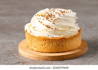 Lemon tartlets with whipped cream, sprinkles and chocolate chips on white background - Powered by Shutterstock