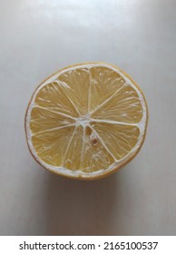 A Lemon That Has Been Split In Half And Only One Left