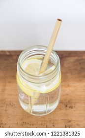 Lemon Water And Bamboo Drinking Straw.