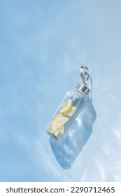 Lemon water drink detox in bottle, shadow at sunlight on abstract texture blue water background. Wellness, diet, eating healthy concept. Top view glass reusable water bottle, eco friendly lifestyle - Shutterstock ID 2290712465