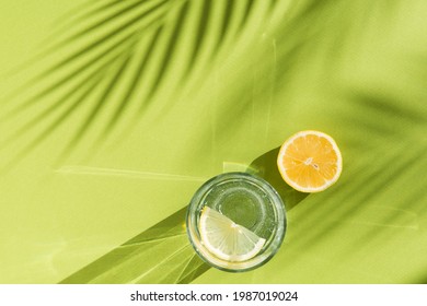 Lemon Water And Palm Tree Shadow On Green Background With Shadows