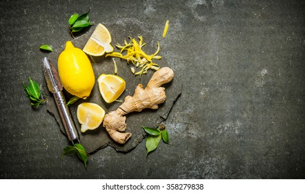 Lemon Zest, Ginger And Leaves On A Stone Stand. On The Stone Table. Free Space For Text . Top View