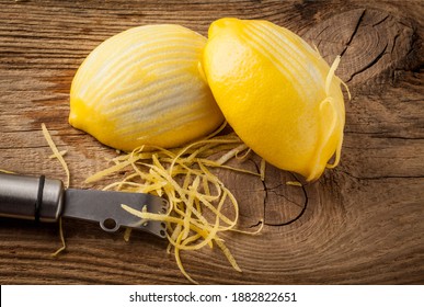 Lemon Zest And Zester On Wooden Board