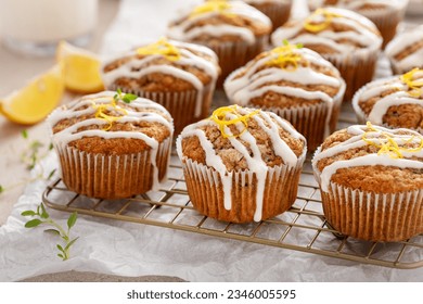 Lemon zucchini muffins with thyme and drizzled with cream cheese glaze