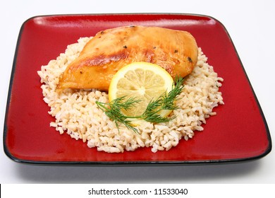 Lemonade Chicken And Brown Rice With Lemon Slice And Dill.