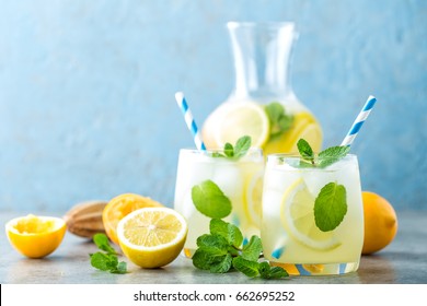 Lemonade Or Mojito Cocktail With Lemon And Mint, Cold Refreshing Drink Or Beverage With Ice
