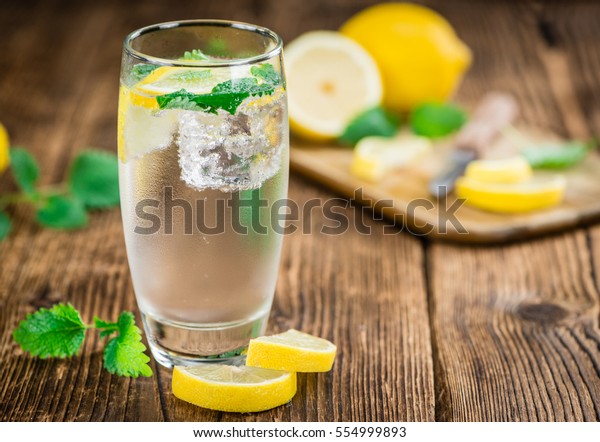 Lemonade on a vintage background as detailed\
close-up shot (selective\
focus)