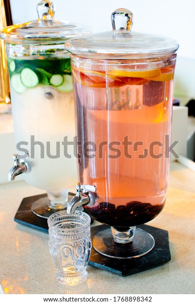 Lemonade\
and strawberry lemonade beverage station for fun party. Beverage\
dispenser pouring station to host a fun BBQ.\
