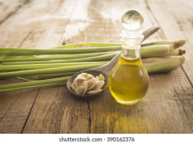 Lemongrass Essential Oils Placed On A Wooden Table. Spa Concept.