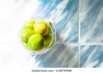 lemons in bottle on blue pattern