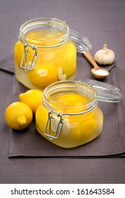 Lemons With Garlic Preserved In Glass Jar