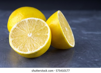 lemons and limes on a gray background.. - Powered by Shutterstock