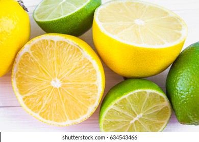 Lemons And Limes On A Wooden Background.