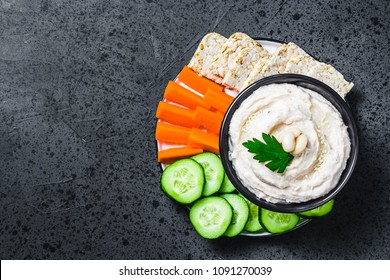 Lemony Garlic White Bean Dip On Dark Concrete Background. Top View, Space For Text. 