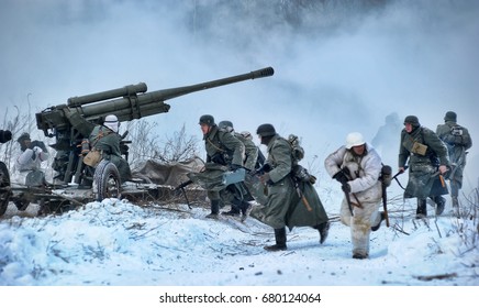 LENINGRAD REGION, RUSSIA - JANUARY 22, 2012: The german gunners during the Second world war to occupy the position. Military-historical reconstruction of the battle that broke the siege of Leningrad