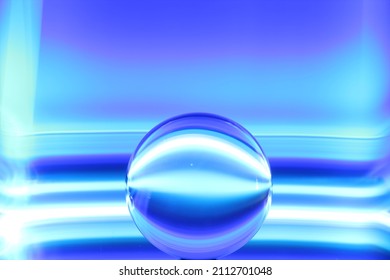 Lens ball with white and blue stripes on the blue background