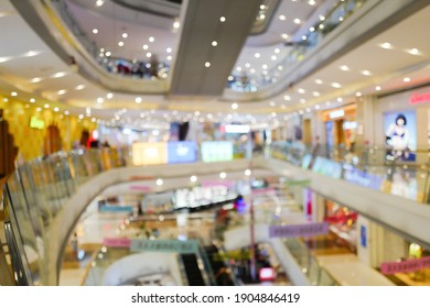 Lens Blur Effect: Colorful Shopping Mall Interior. Background Screen.